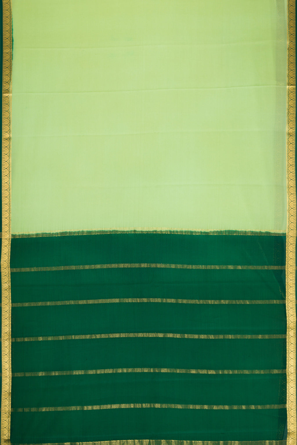 Flat view of Pista Green Dual Tone Mysore Crepe Saree with Plain Body and Zari Border. 