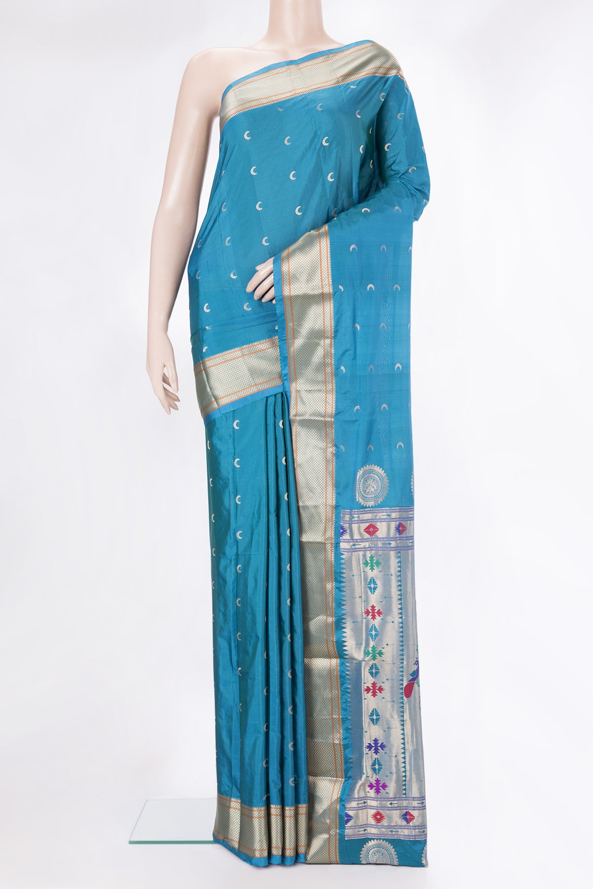 Peacock Blue Blended Paithani Silk Saree with Zari Butta on the body and Zari Border.  displayed on a mannequin