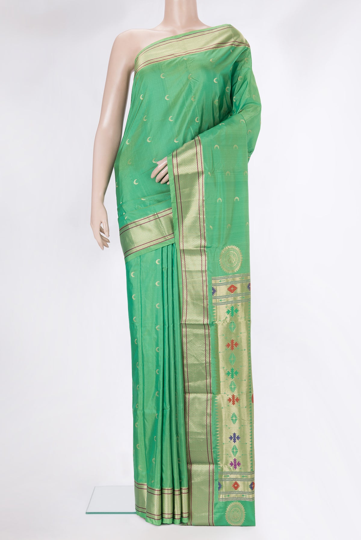 Green Blended Paithani Silk Saree with Zari Butta on the body and Zari Border.  displayed on a mannequin