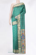 Green Blended Paithani Silk Saree with Zari Butta on the body and Zari Border.  displayed on a mannequin