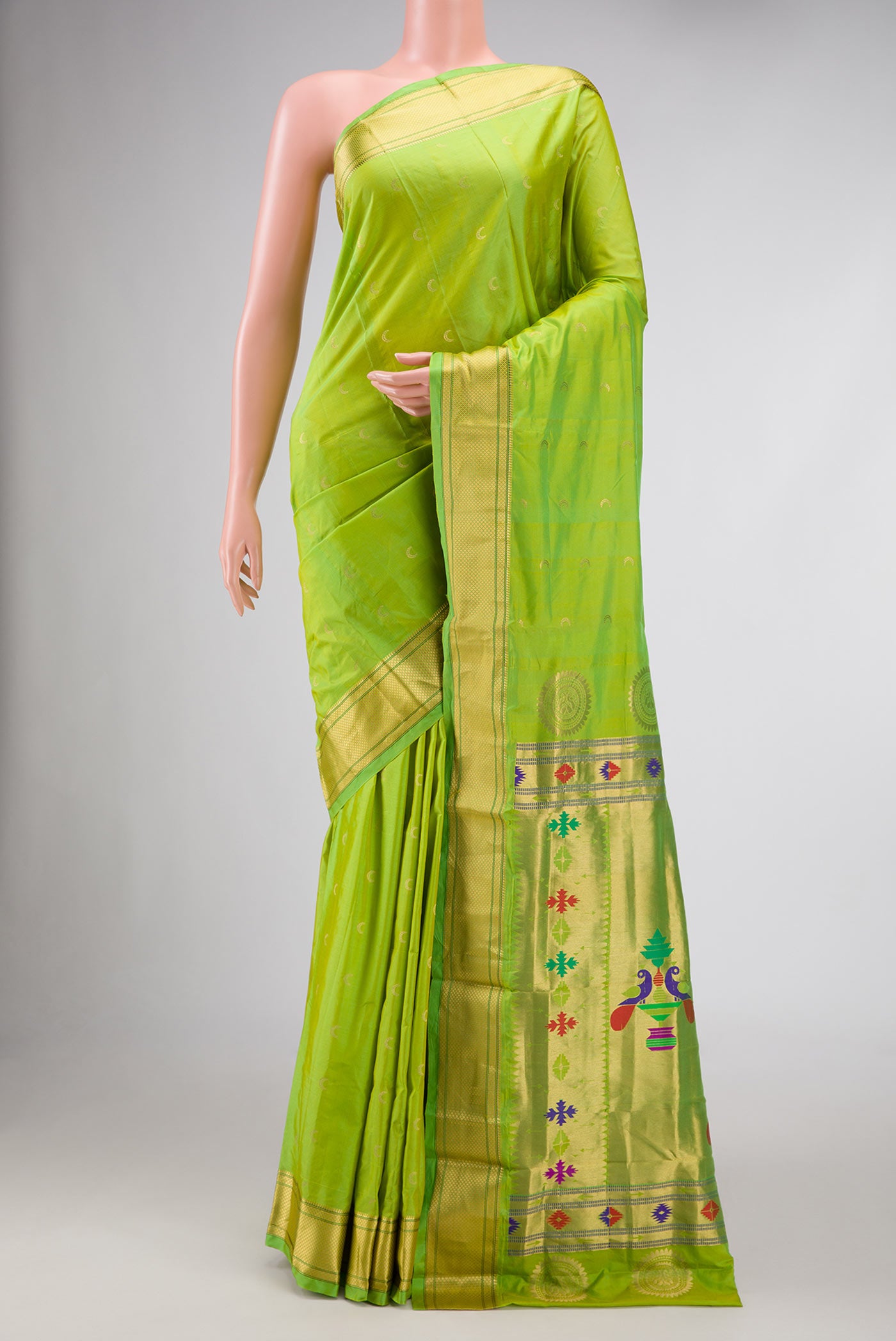 Parrot Green Dual Tone Paithani Silk Saree with Zari Butta on the body and Zari Border.  displayed on a mannequin