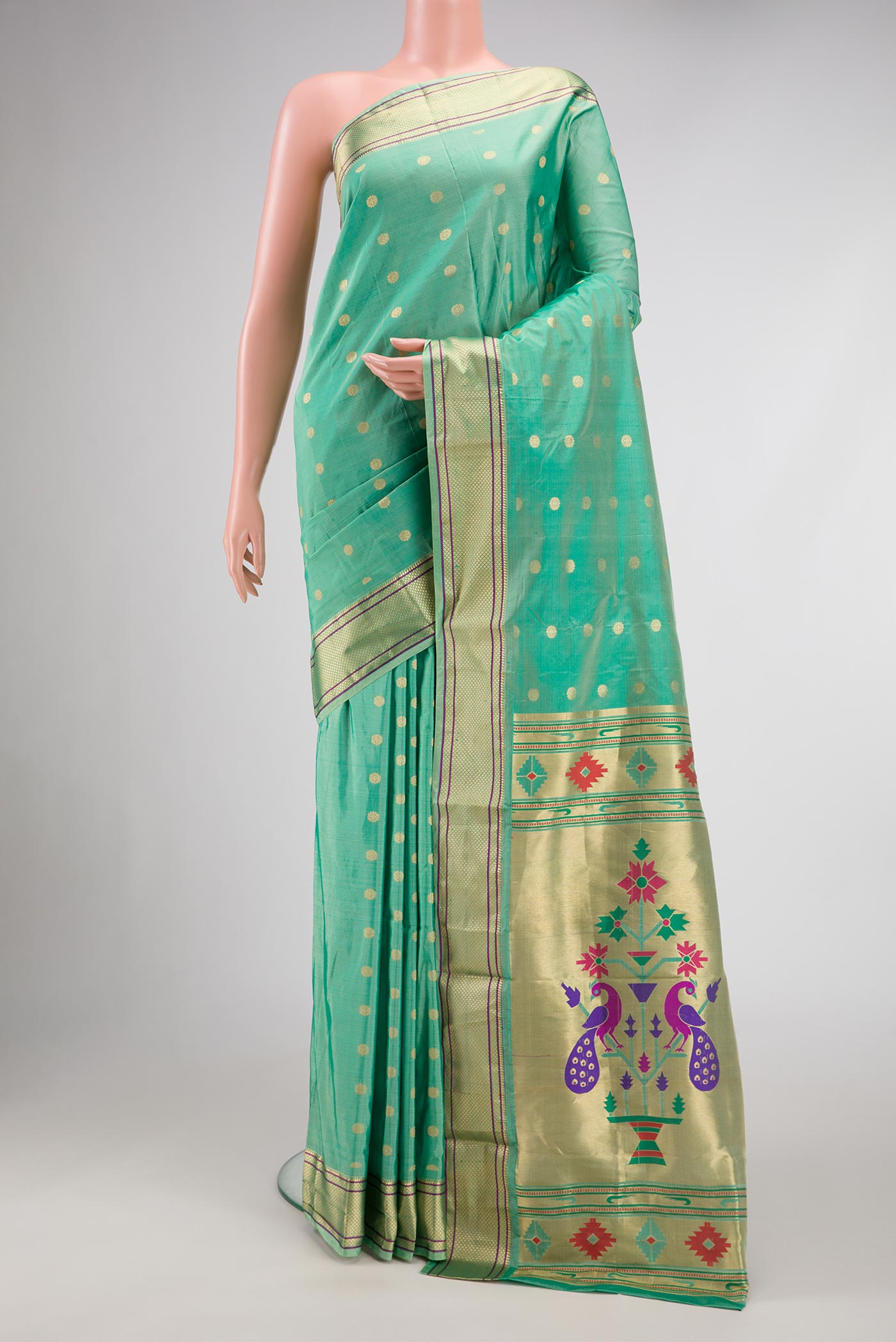 Sea Green Blended Bangalore Silk Saree with Zari Butta on the body and Zari Border displayed on a mannequin