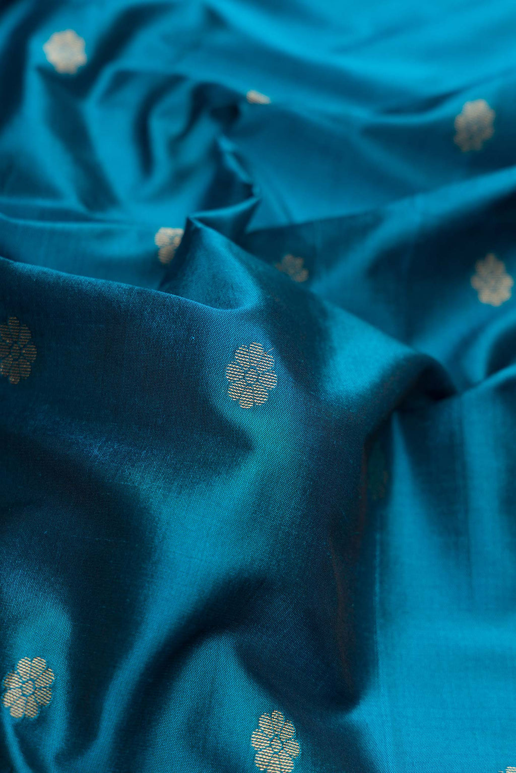 Close up of Blue Blended Bangalore Silk Saree with Zari Butta on the body and Zari Border displaying folds