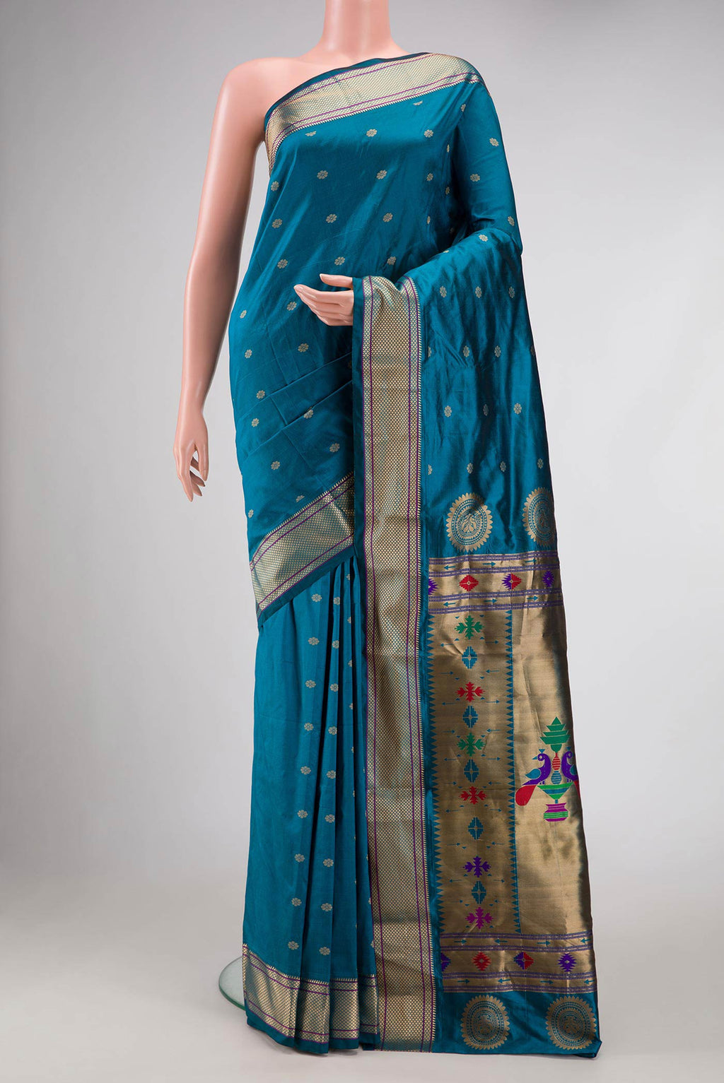 Blue Blended Bangalore Silk Saree with Zari Butta on the body and Zari Border displayed on a mannequin