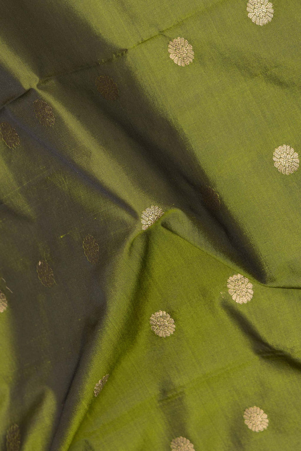 Close up of Mehandi Green Blended Paithani Silk Saree with Zari Butta on the body and Zari Border.  displaying folds