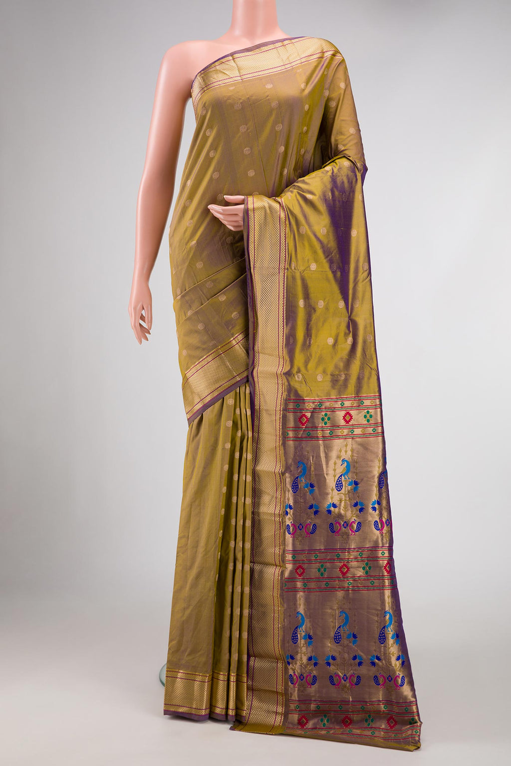 Green with Purple Color Blended Bangalore Silk Saree with Zari Butta on the body and Zari Border displayed on a mannequin