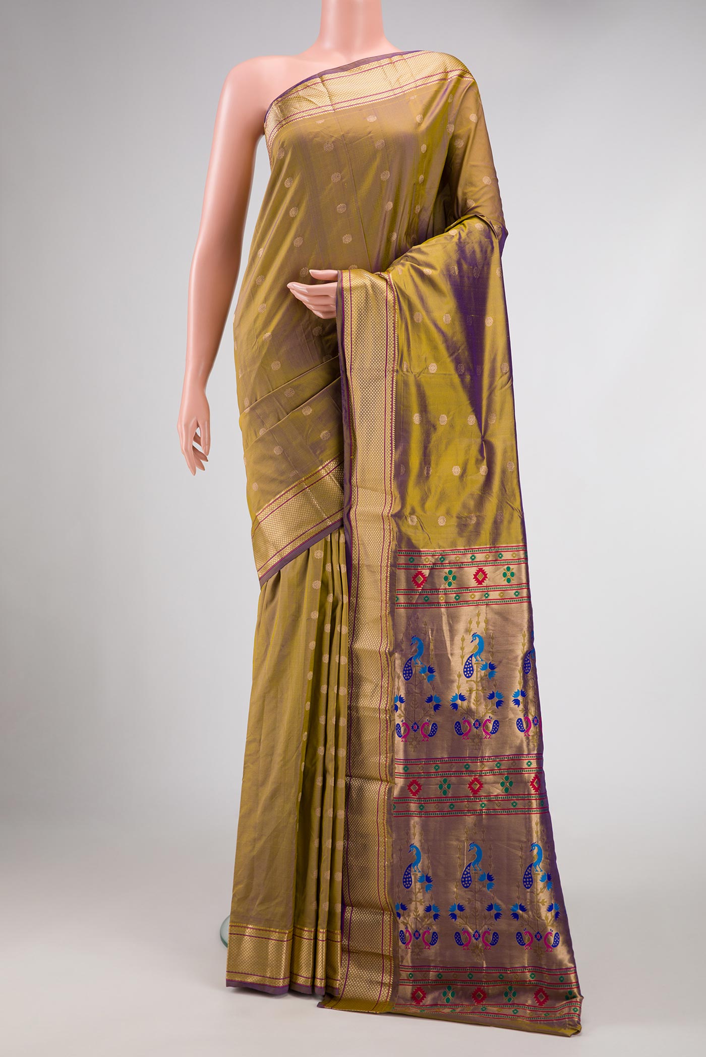 Green with Purple Color Blended Bangalore Silk Saree with Zari Butta on the body and Zari Border displayed on a mannequin