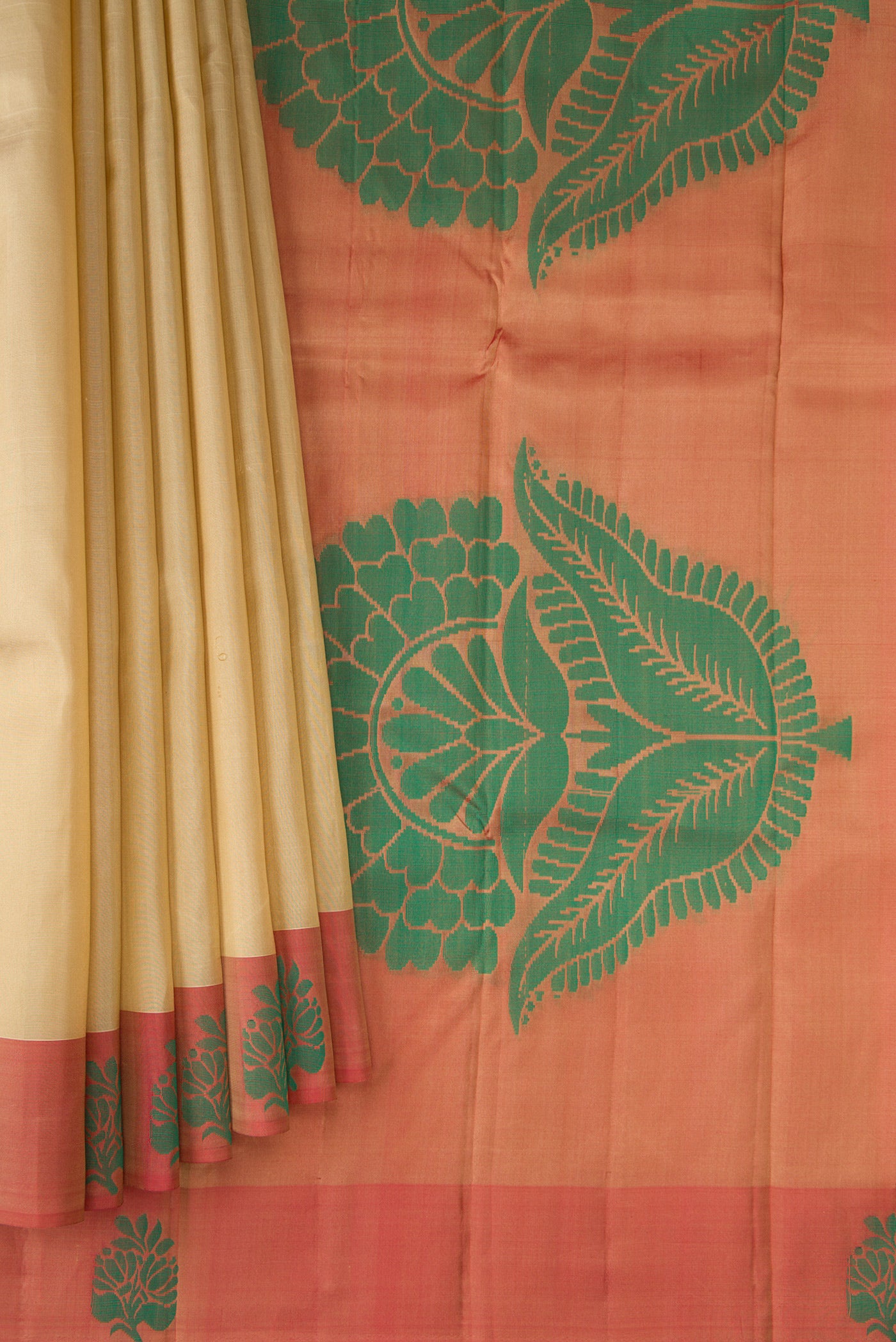 Pleats and pallu of Dark Beige Kanjivaram Silk Saree with Plain Body and Thread Border. 