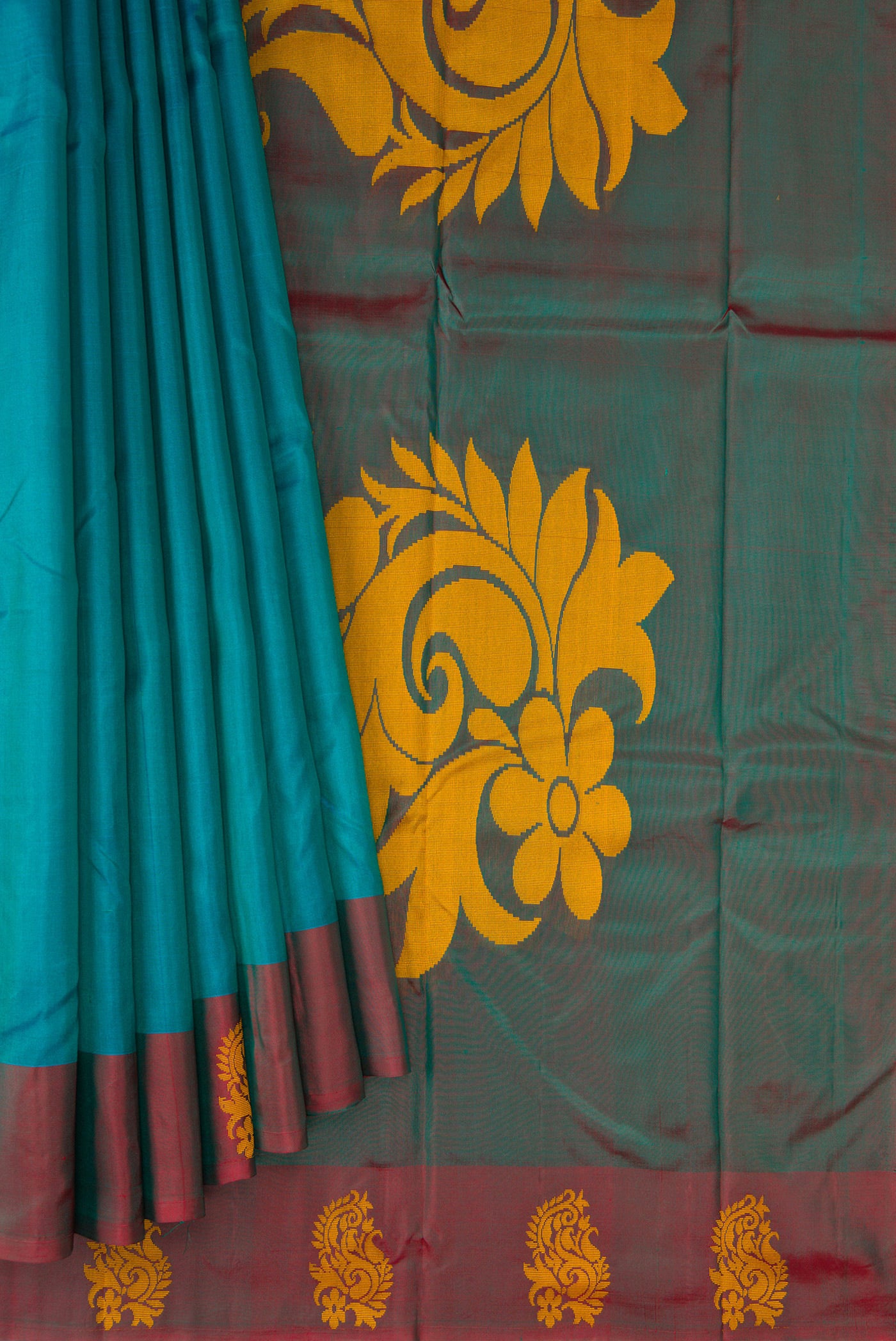Pleats and pallu of Peacock Blue Dual Tone Soft Silk Saree with Plain Body and Fancy Border. 