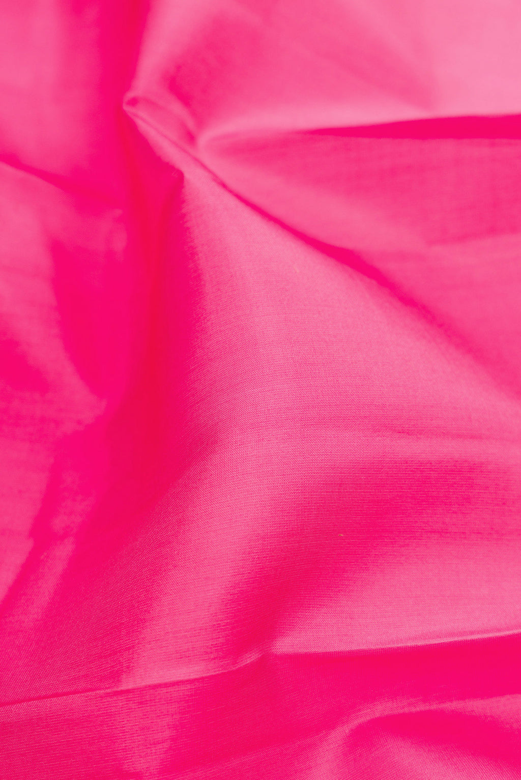 Close up of Pink Soft Silk Saree with Plain Body and Fancy Border.  displaying folds