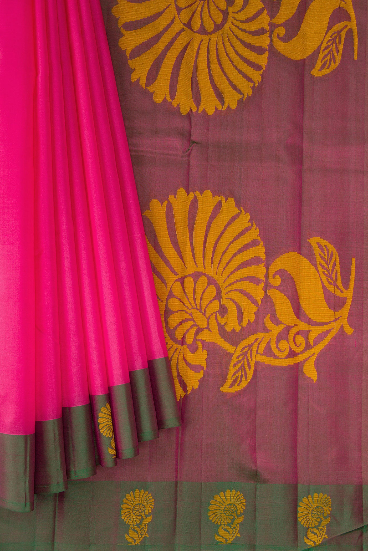 Pleats and pallu of Pink Soft Silk Saree with Plain Body and Fancy Border. 