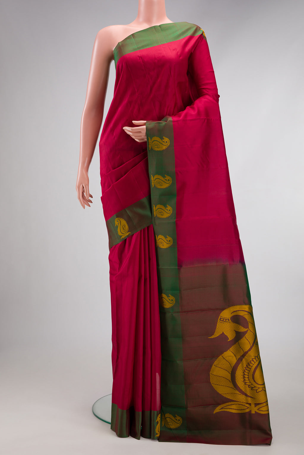 Maroon Kanjivaram Silk Saree with Plain Body and Thread Border.  displayed on a mannequin
