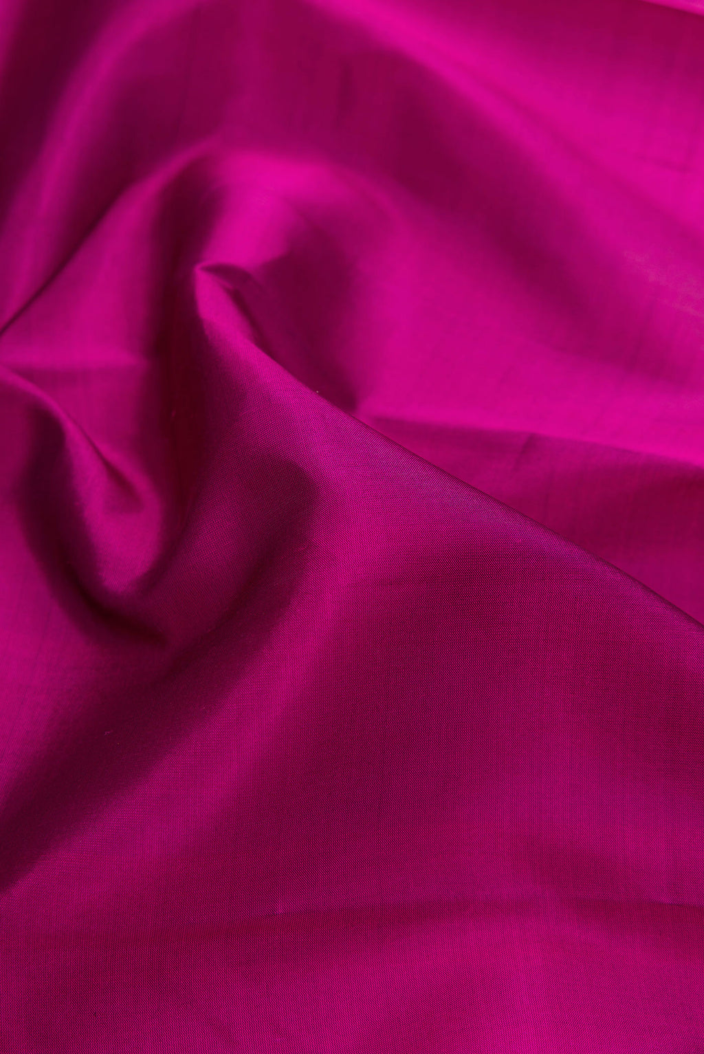 Close up of Purple Soft Silk Saree with Plain Body and Fancy Border.  displaying folds