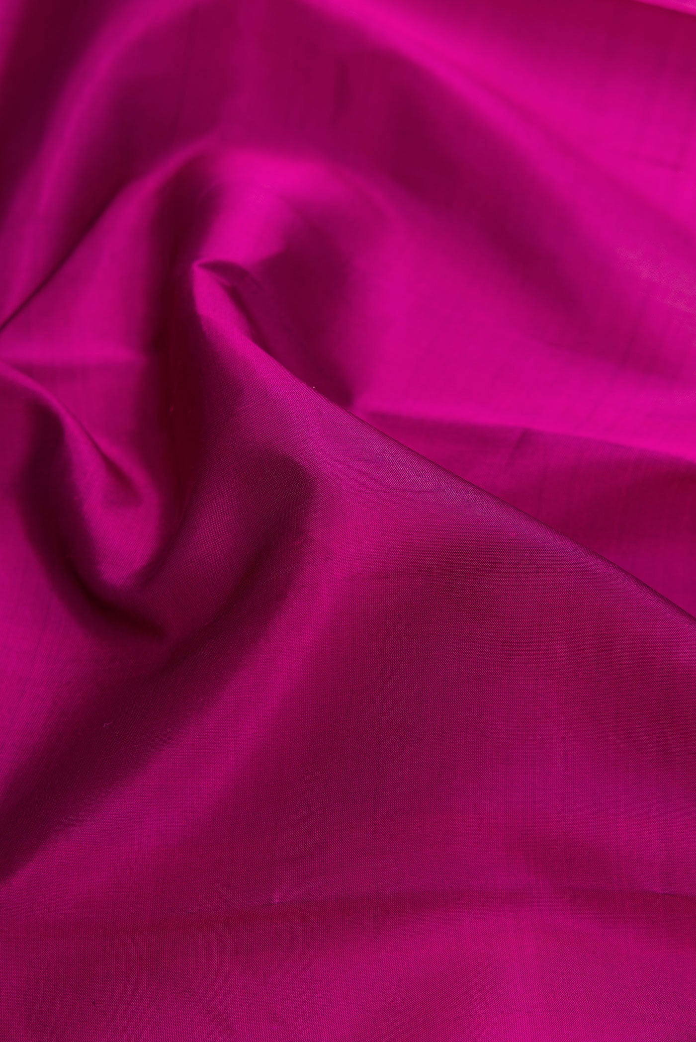 Close up of Purple Soft Silk Saree with Plain Body and Fancy Border.  displaying folds
