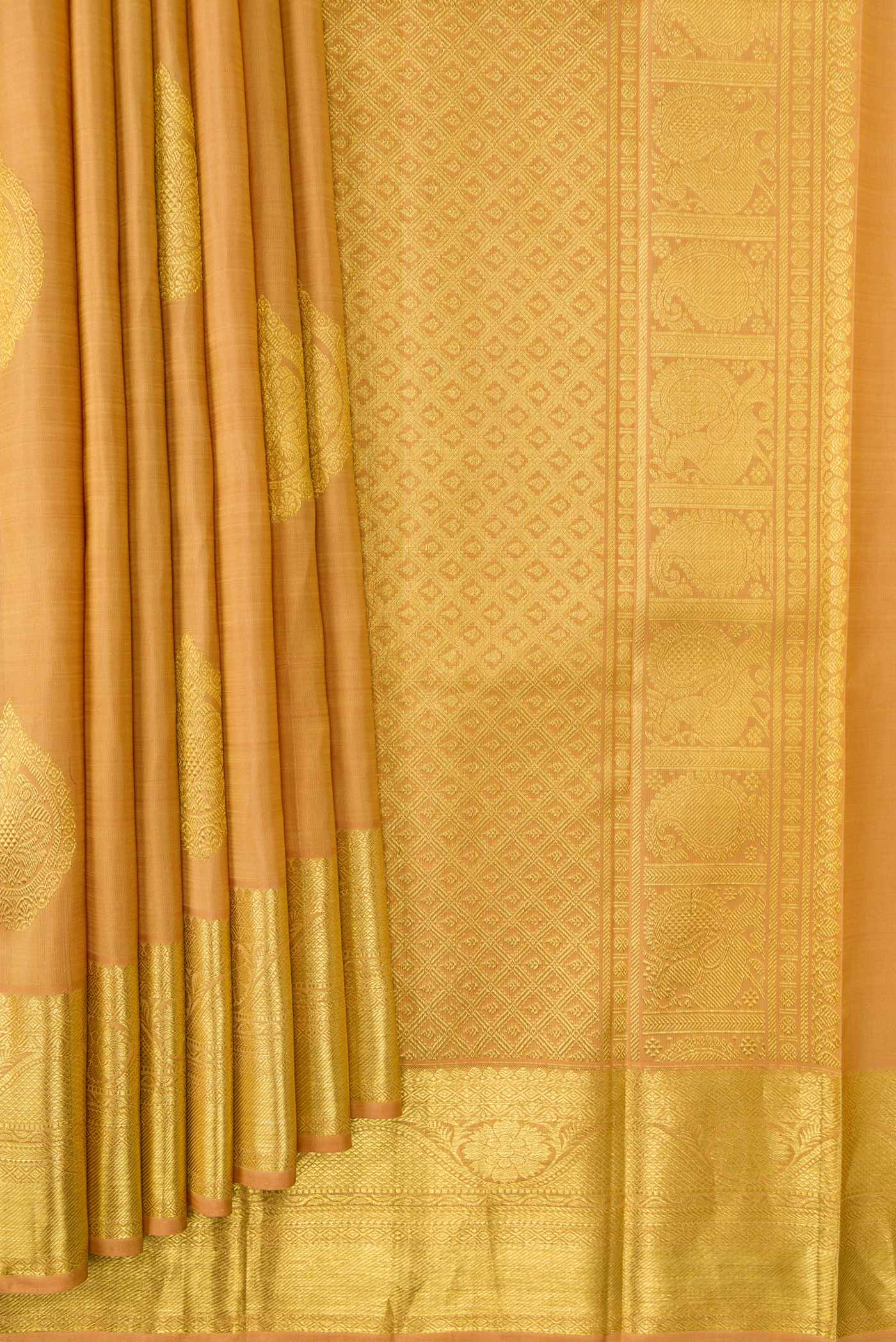 Pleats and pallu of Sandal Dual Tone Kanjivaram Silk Saree with Zari Butta on the body and Zari Border. 