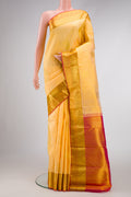 Sandal Dual Tone Kanjivaram Silk Saree with Zari Butta on the body and Zari Border.  displayed on a mannequin