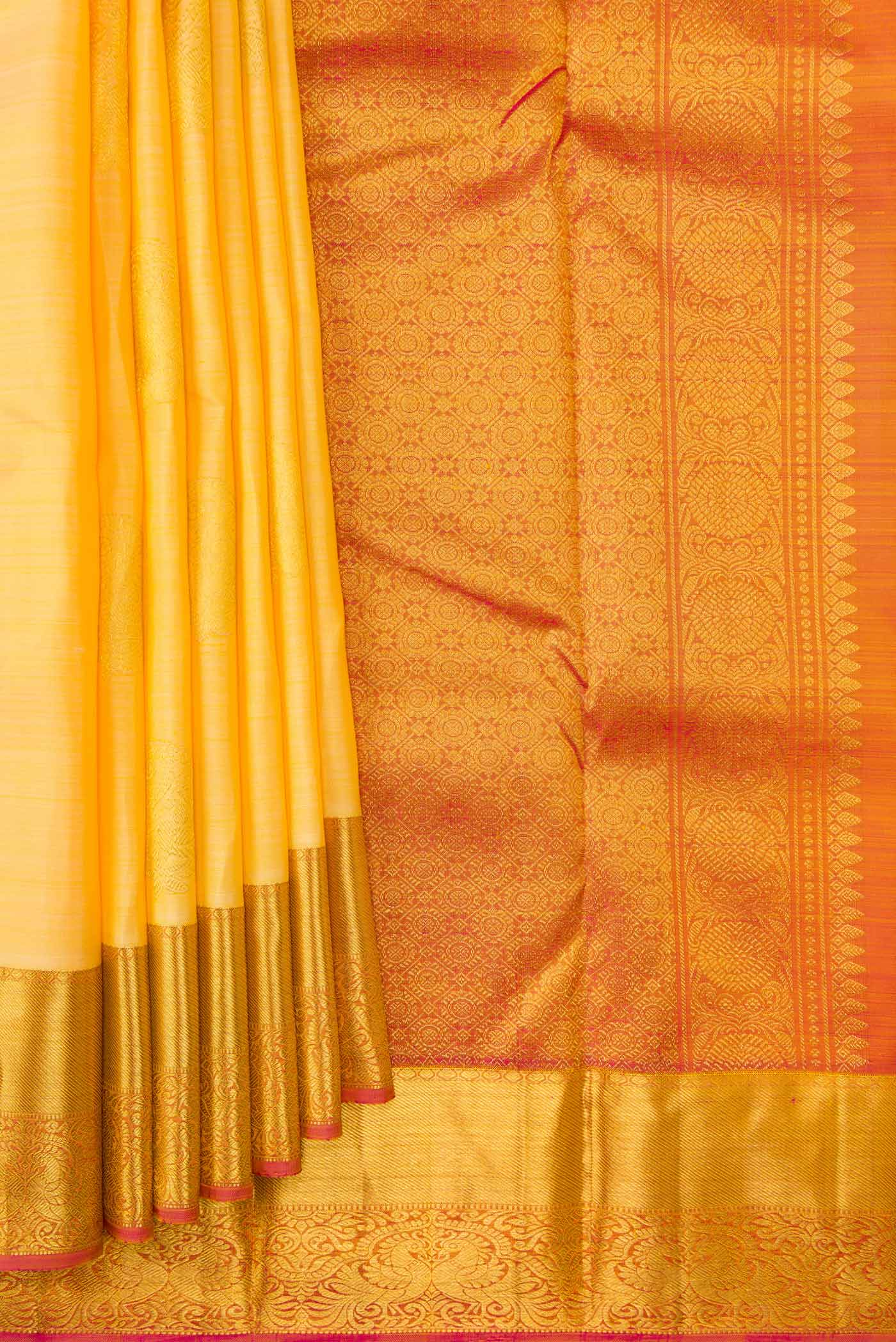 Pleats and pallu of Sandal Dual Tone Kanjivaram Silk Saree with Zari Butta on the body and Zari Border. 
