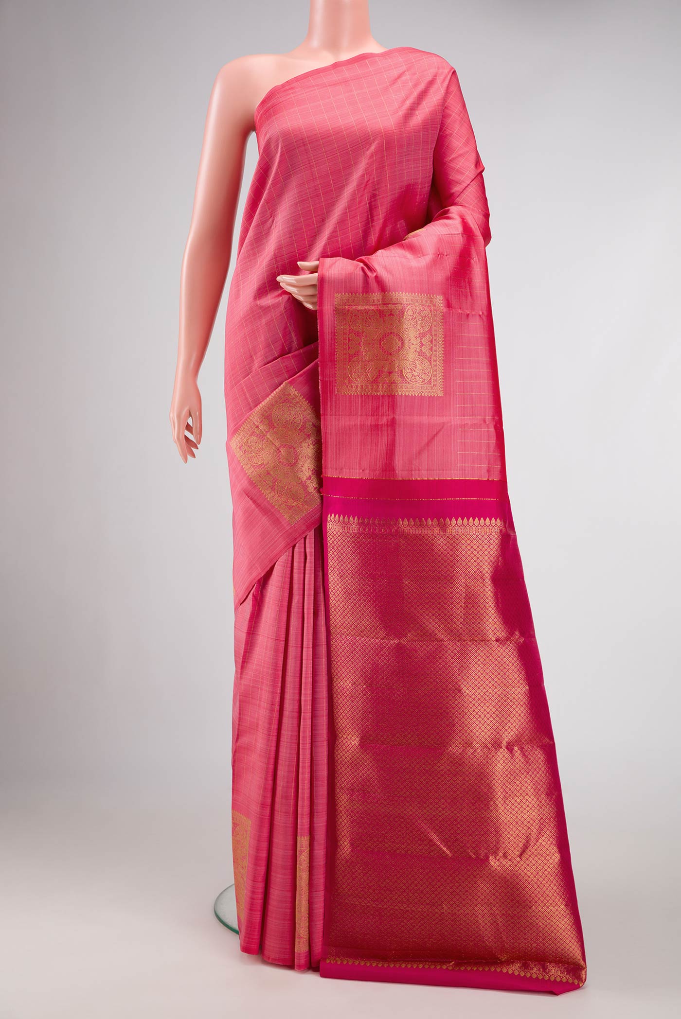 Pink Dual Tone Kanjivaram Silk Saree with Checked design on the body and Fancy Border.  displayed on a mannequin