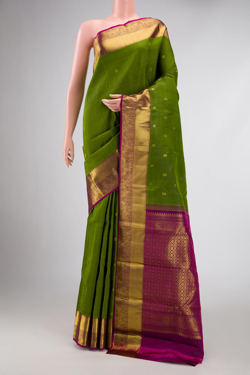 Mehandi Green Dual Tone Kanjivaram Silk Saree with Zari Butta on the body and Zari Border.  displayed on a mannequin