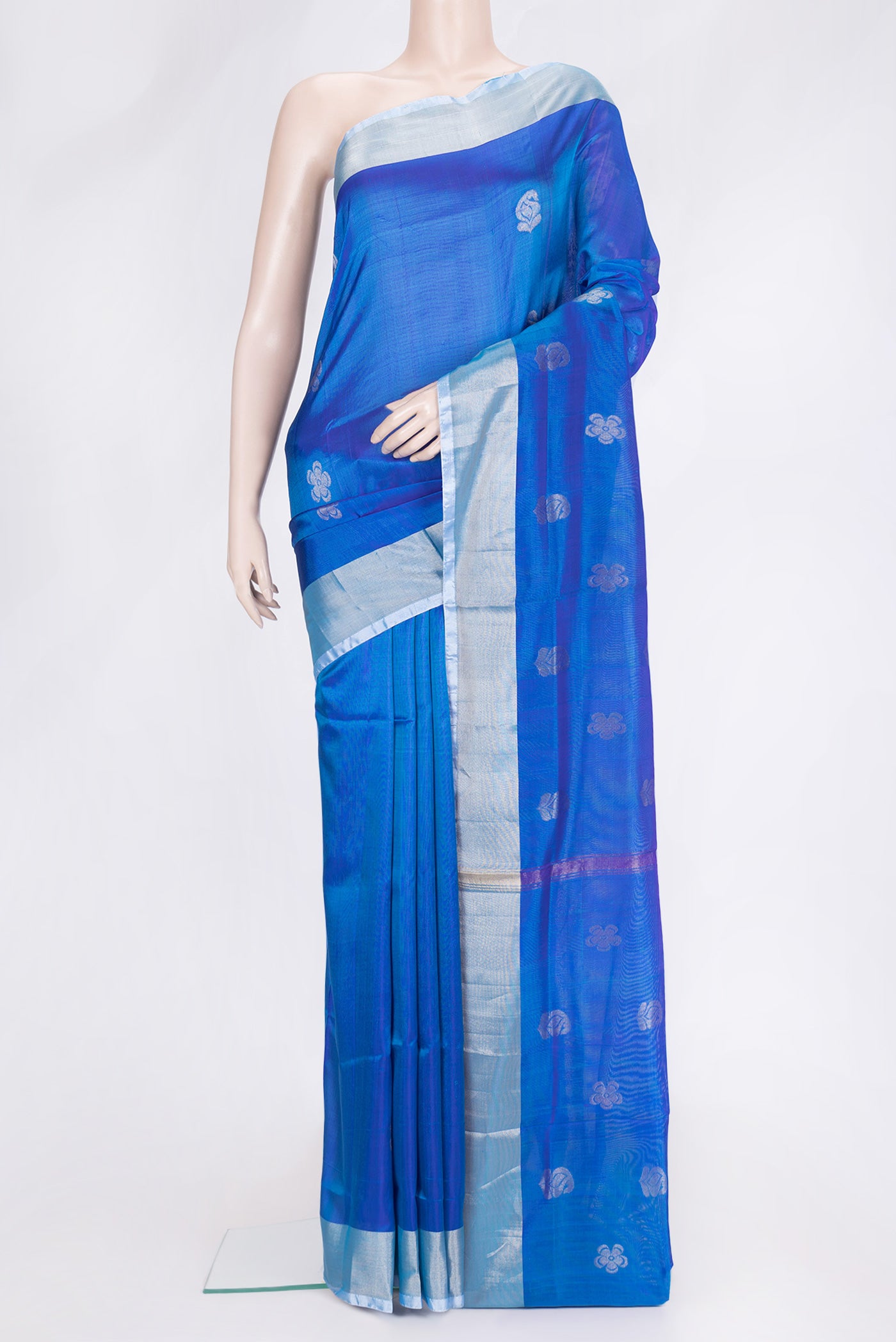 Peacock Blue Dual Tone Uppada Silk Saree with Zari Butta on the body and Zari Border.  displayed on a mannequin