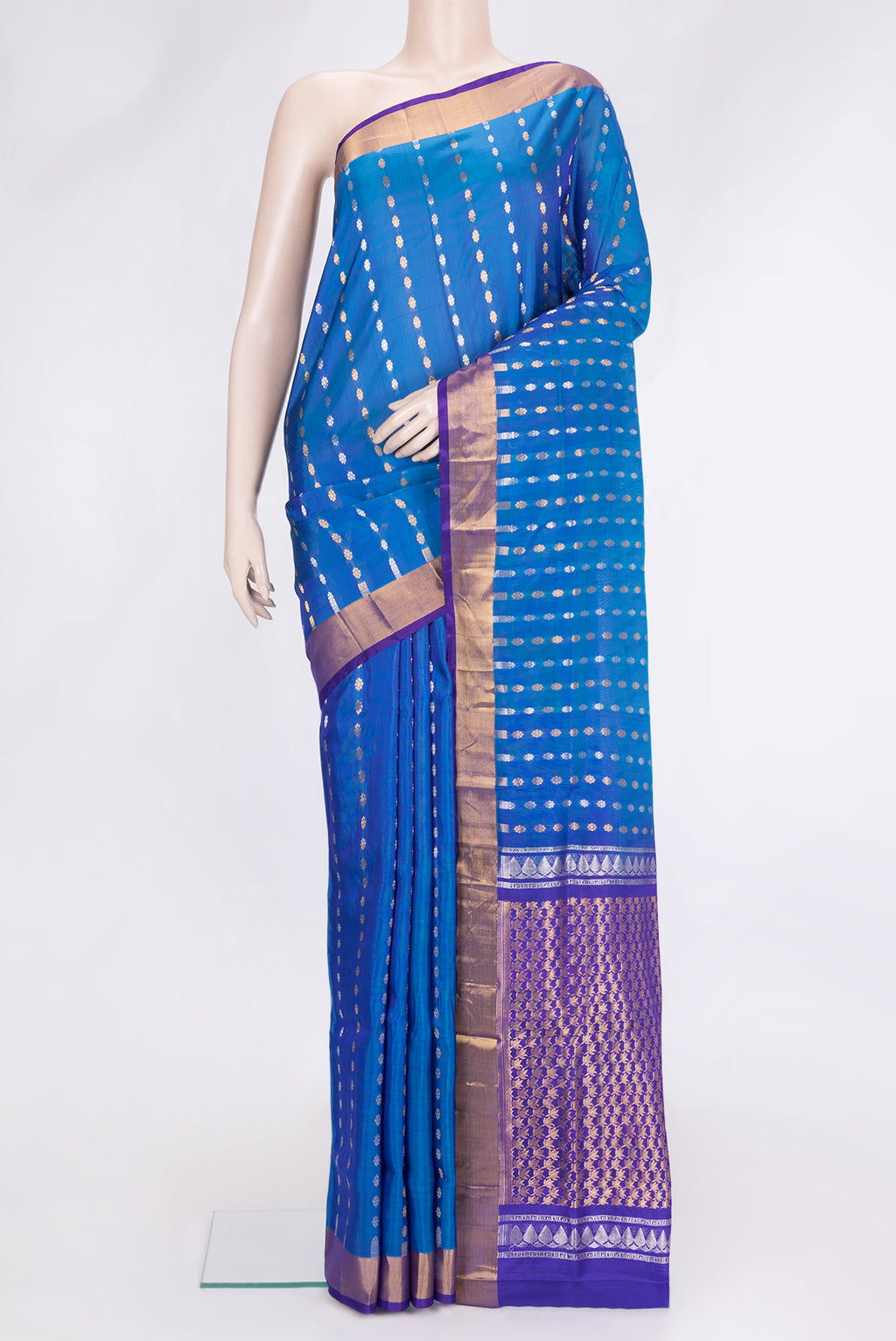 Peacock Blue Dual Tone Uppada Silk Saree with Zari Butta on the body and Zari Border.  displayed on a mannequin
