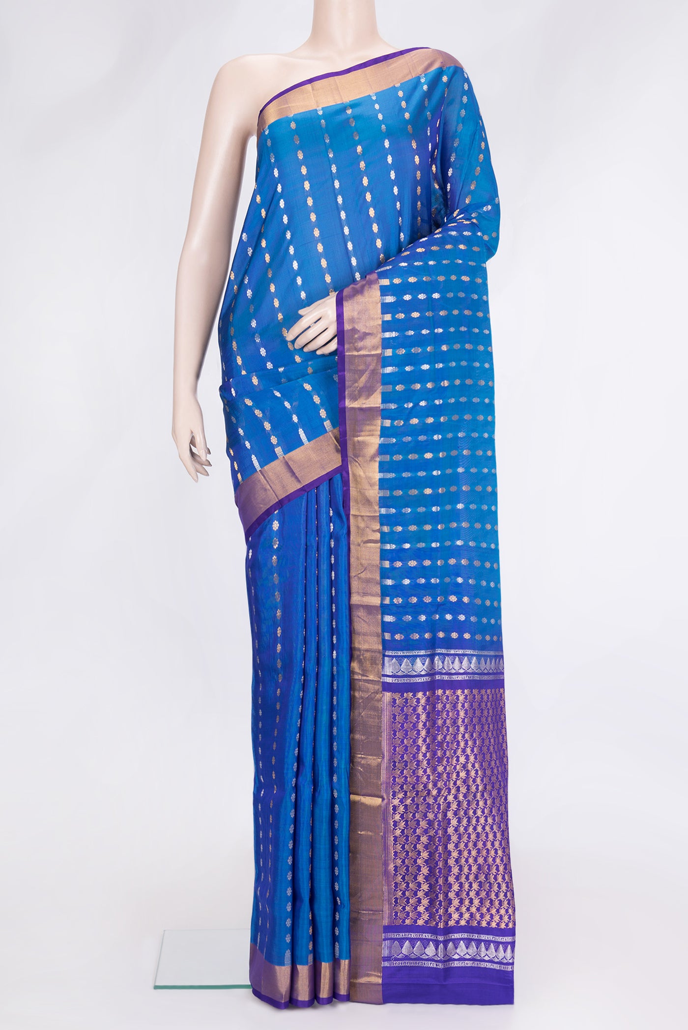 Peacock Blue Dual Tone Uppada Silk Saree with Zari Butta on the body and Zari Border.  displayed on a mannequin