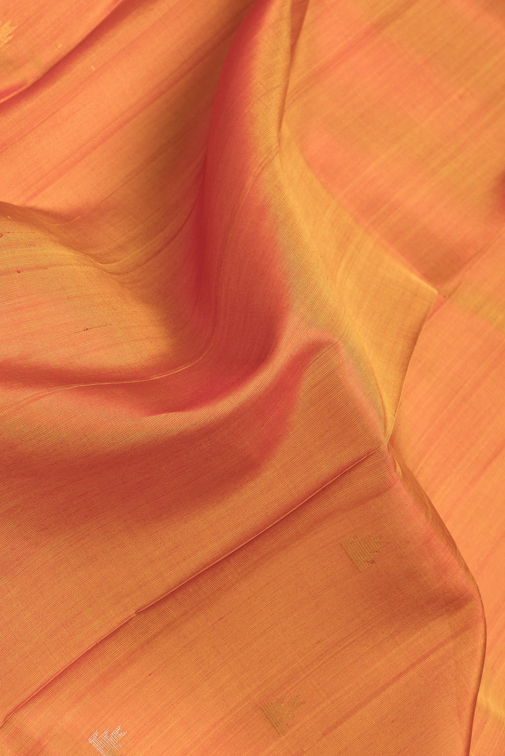 Close up of Mustard Dual Tone Uppada Silk Saree with Zari Butta on the body and Temple Border.  displaying folds