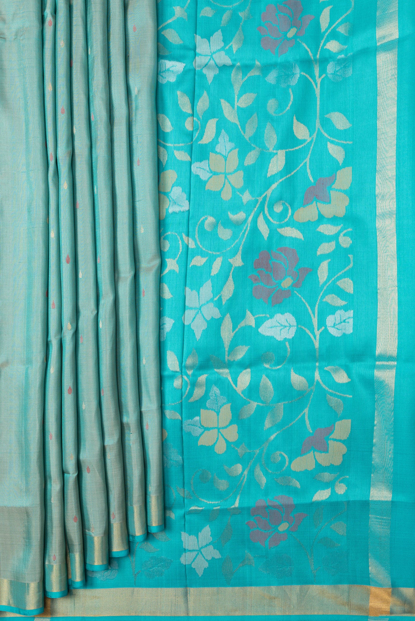 Pleats and pallu of Sea Green Dual Tone Uppada Silk Saree with Zari And Thread Butta on the body and Zari Border. 