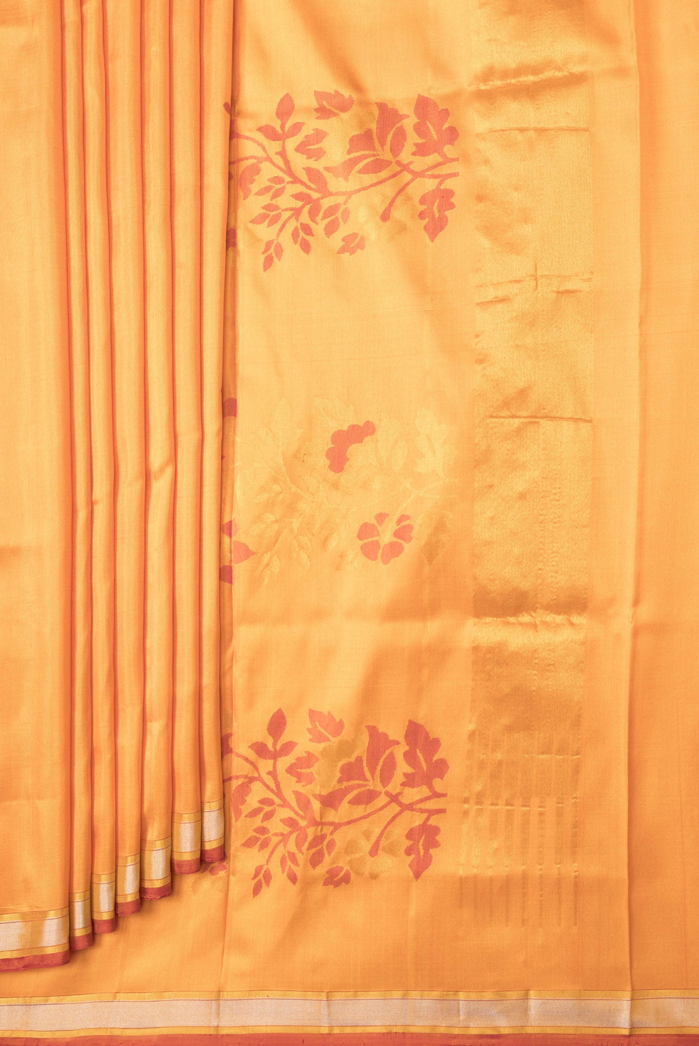 Pleats and pallu of Orange Dual Tone Uppada Silk Saree with Zari And Thread Butta on the body and Zari Border. 