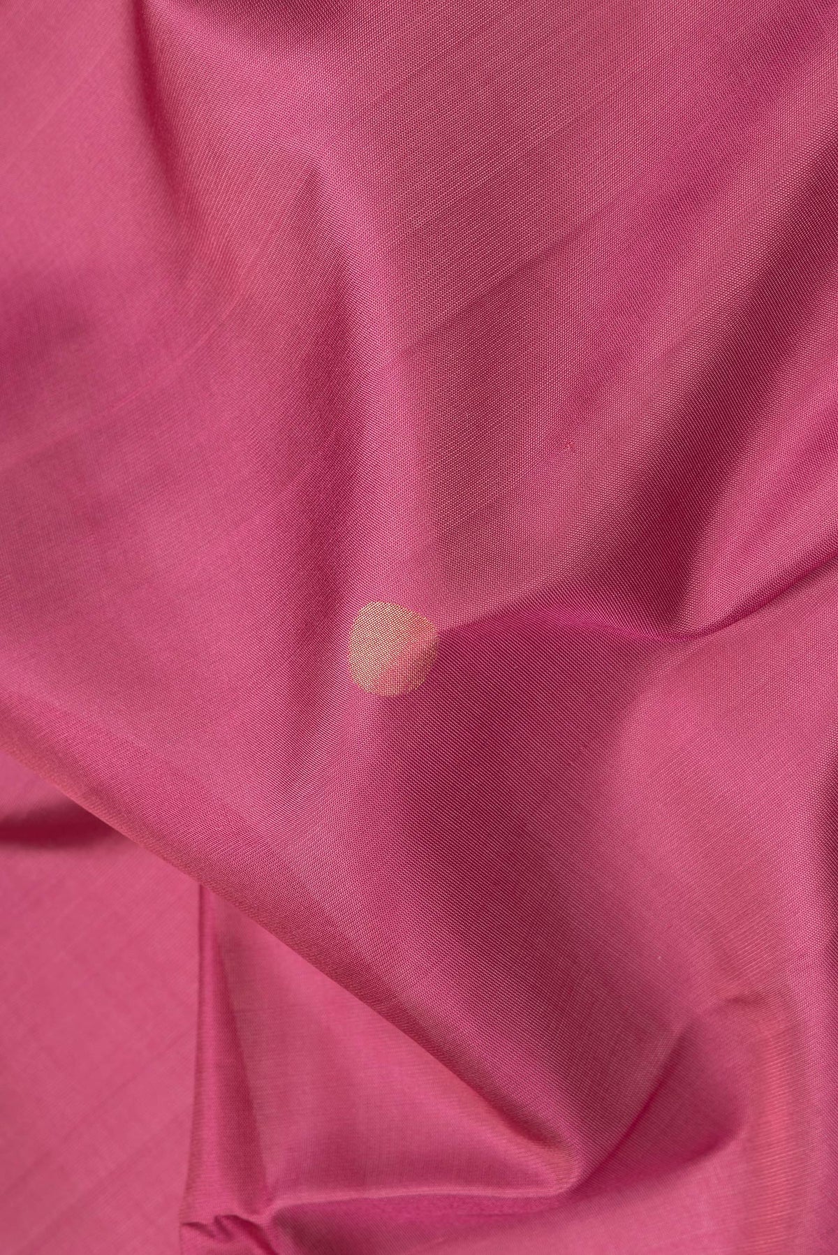 Close up of Dark Pink Dual Tone Uppada Silk Saree with Zari And Thread Butta on the body and Zari Border.  displaying folds