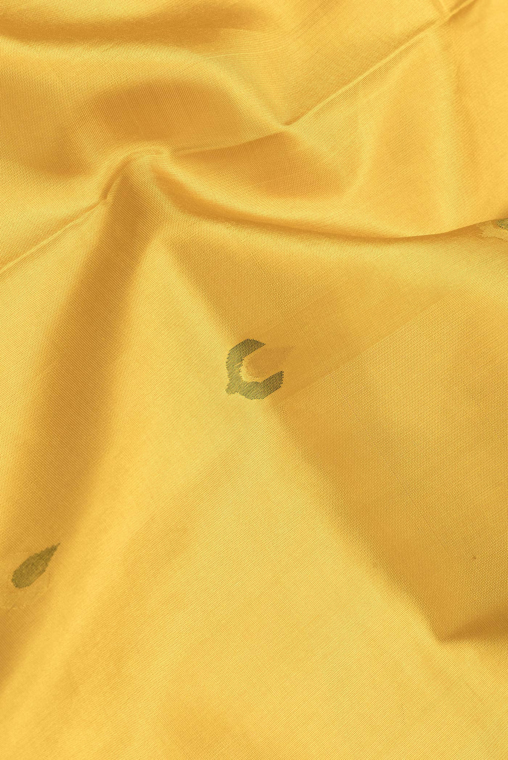 Close up of Mustard Dual Tone Uppada Silk Saree with Zari And Thread Butta on the body and Zari Border.  displaying folds
