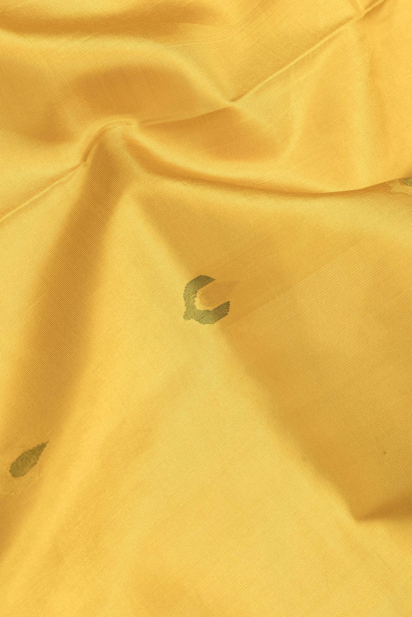 Close up of Mustard Dual Tone Uppada Silk Saree with Zari And Thread Butta on the body and Zari Border.  displaying folds