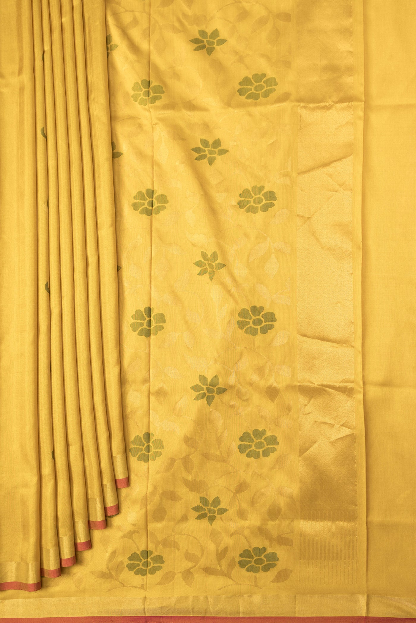 Pleats and pallu of Mustard Dual Tone Uppada Silk Saree with Zari And Thread Butta on the body and Zari Border. 