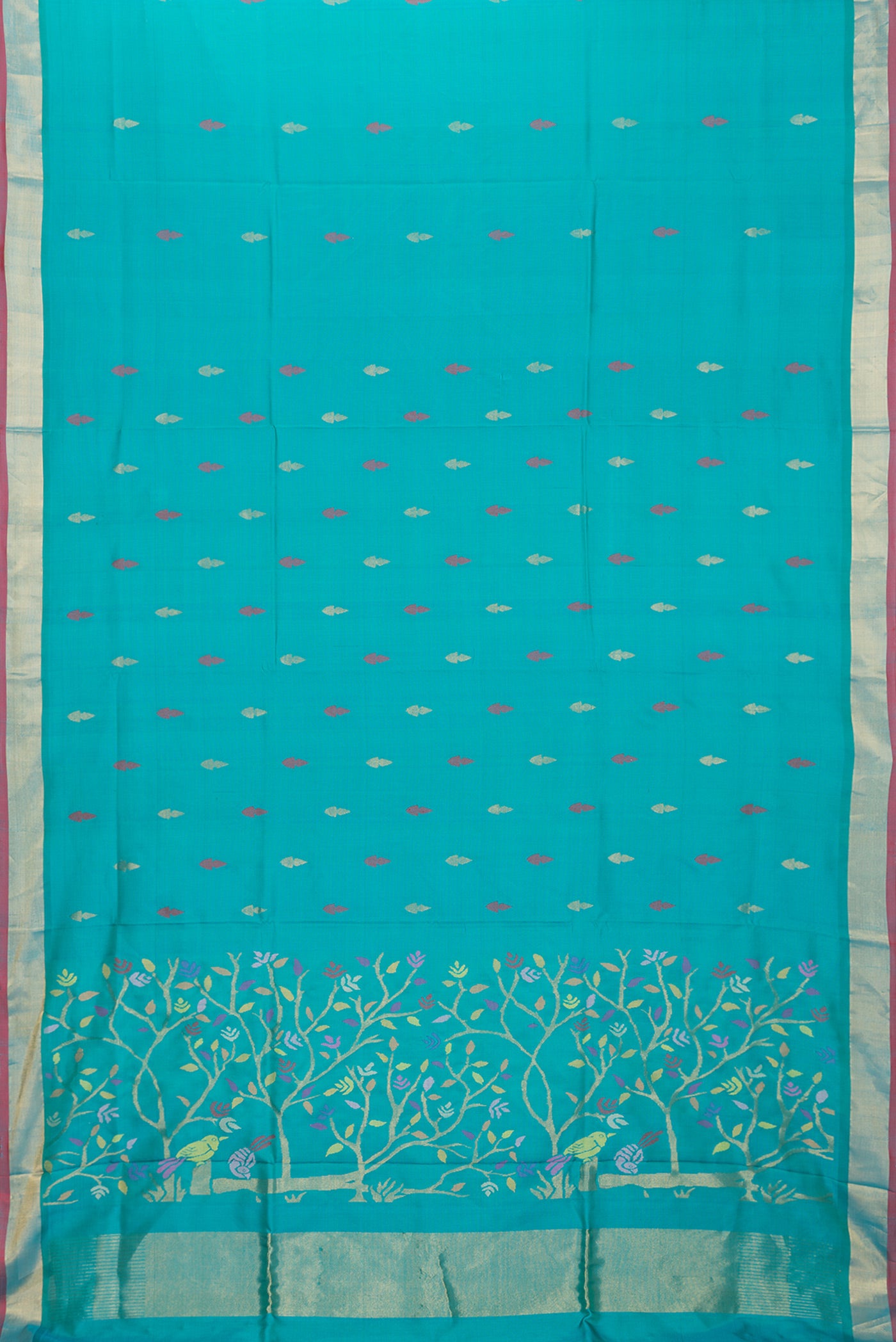 Flat view of Sky Blue Dual Tone Uppada Silk Saree with Zari And Thread Butta on the body and Zari Border. 
