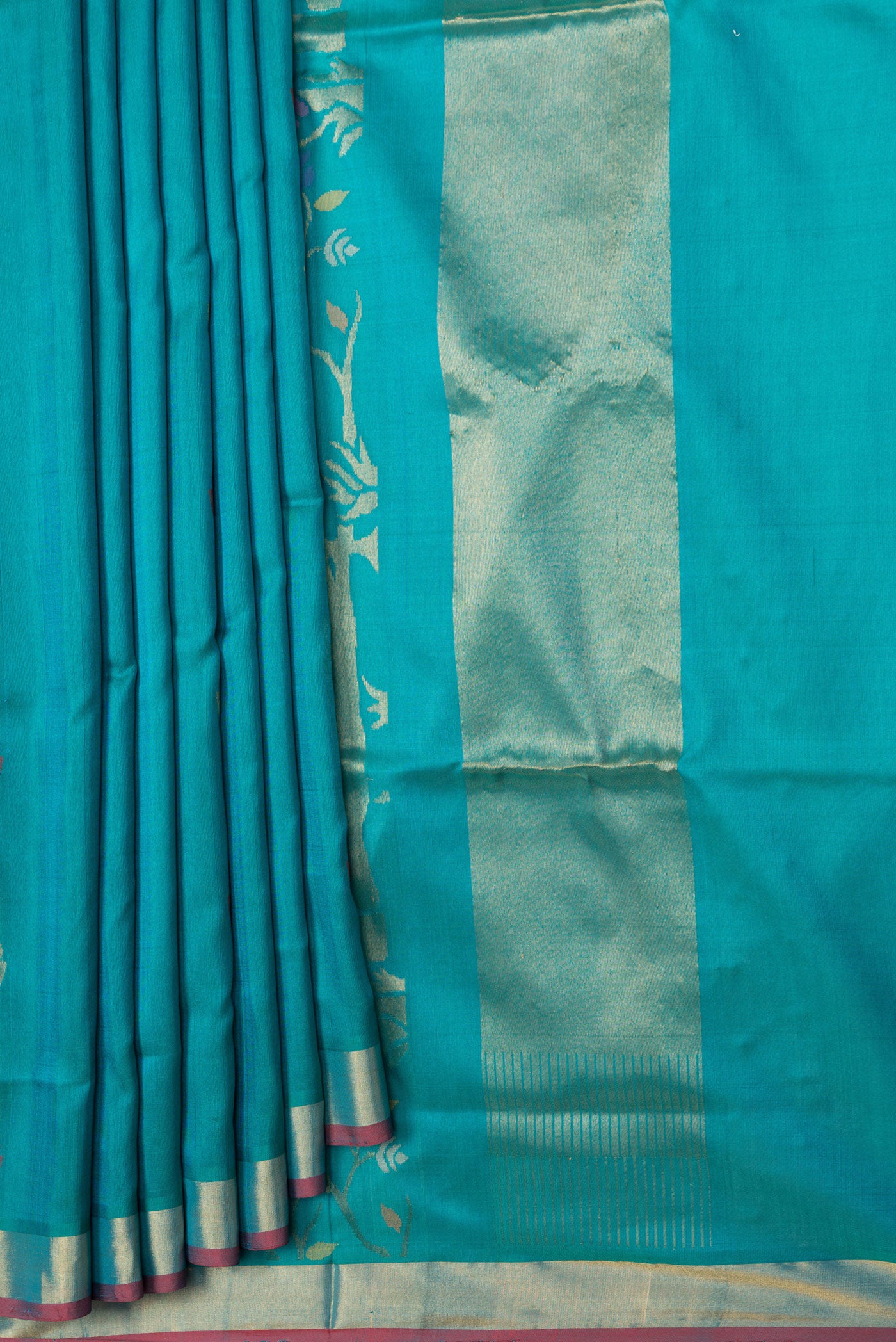 Pleats and pallu of Sky Blue Dual Tone Uppada Silk Saree with Zari And Thread Butta on the body and Zari Border. 