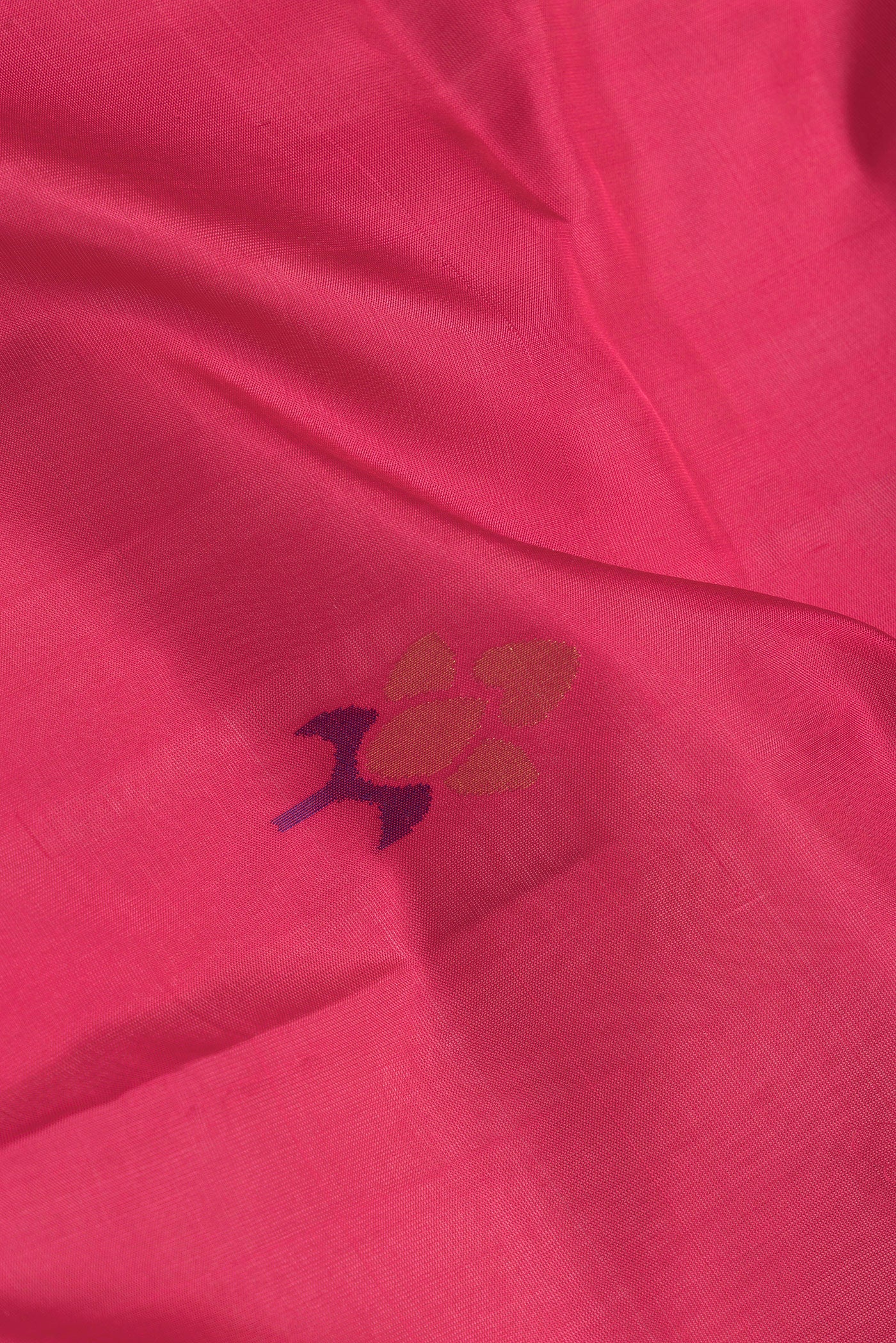 Close up of Pink Dual Tone Uppada Silk Saree with Zari And Thread Butta on the body and Zari Border.  displaying folds