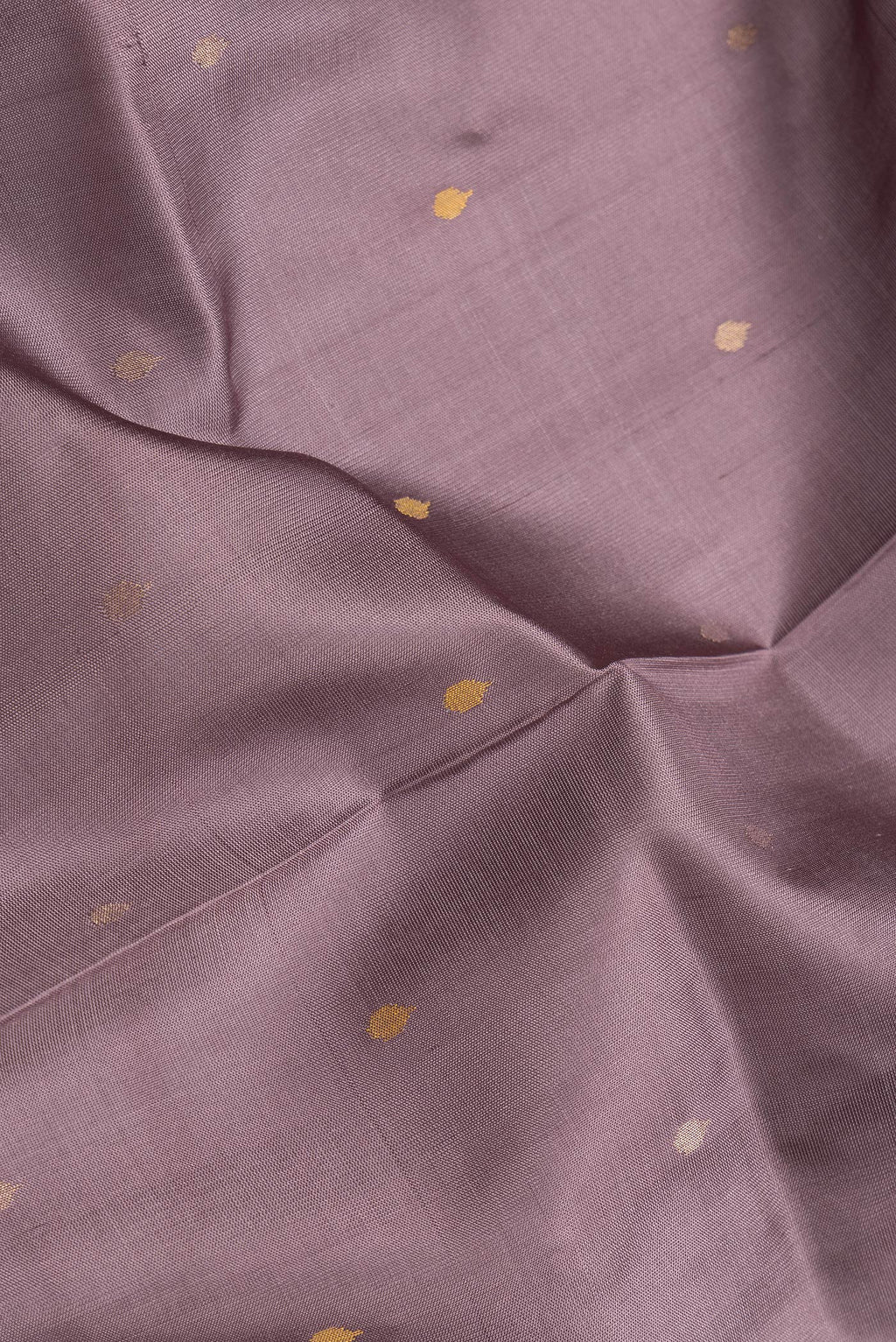 Close up of Purple Dual Tone Uppada Silk Saree with Zari And Thread Butta on the body and Zari Border.  displaying folds