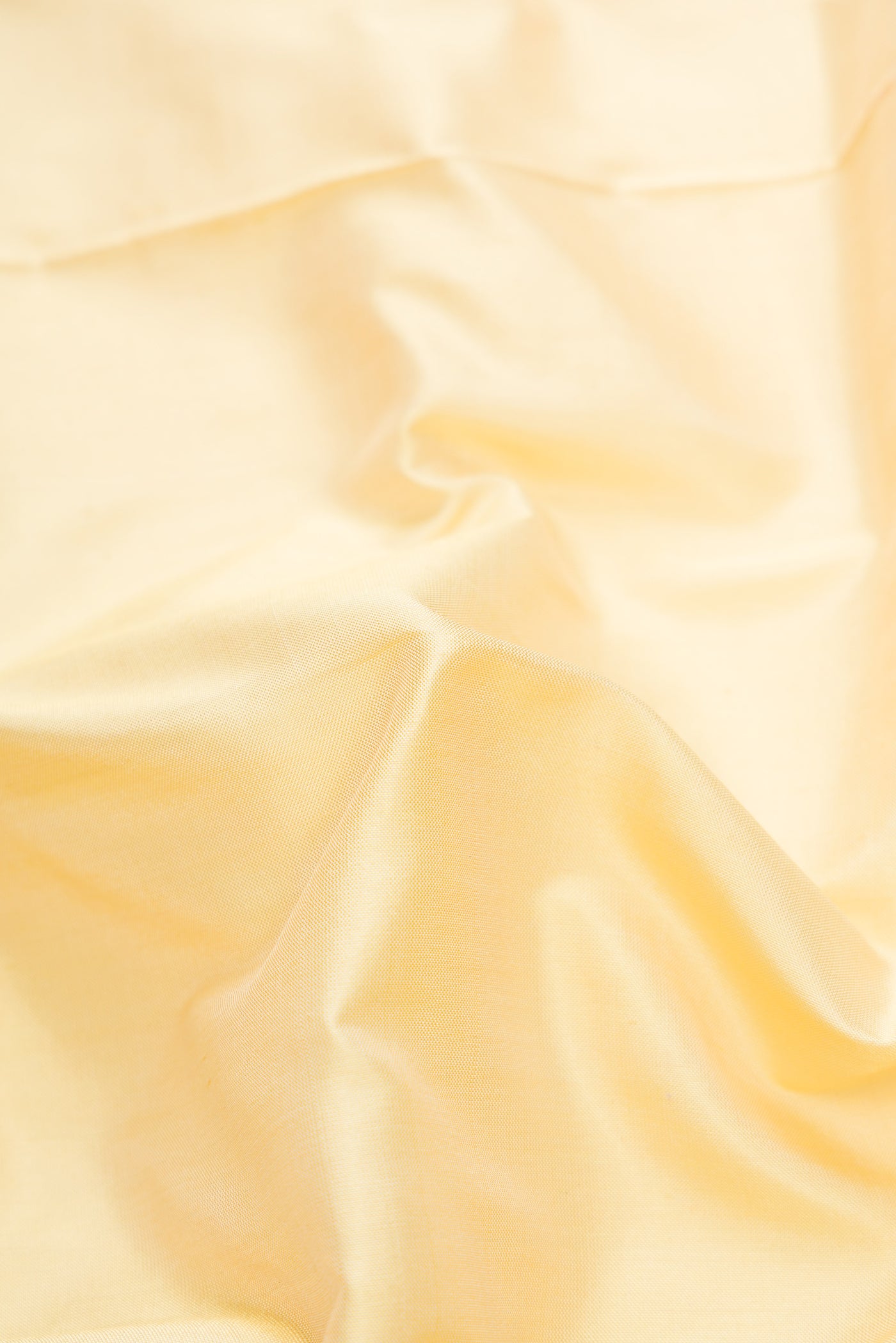 Close up of Sandal Dual Tone Uppada Silk Saree with Plain Body and Zari Border.  displaying folds
