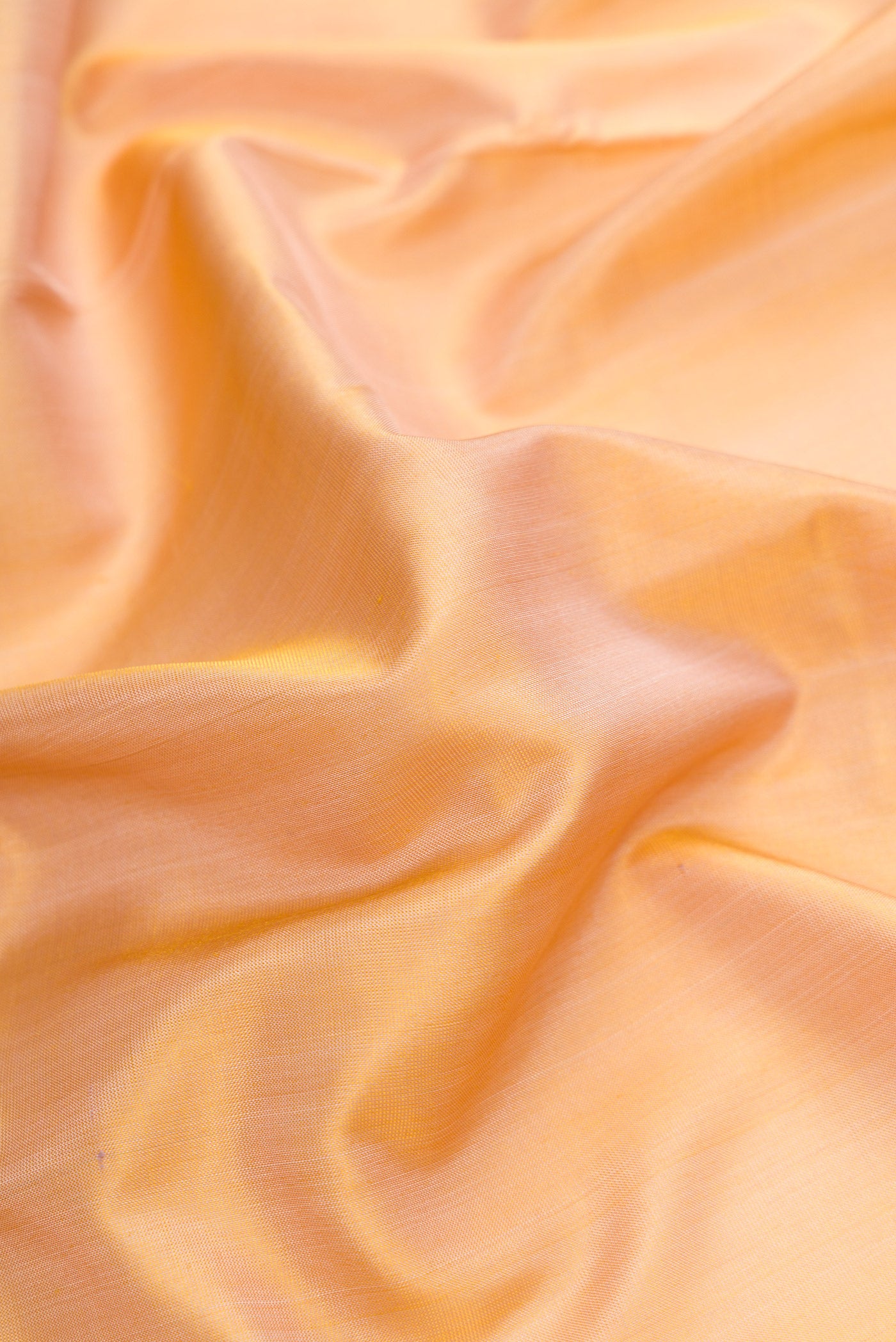 Close up of Sandal Dual Tone Uppada Silk Saree with Plain Body and Zari Border.  displaying folds