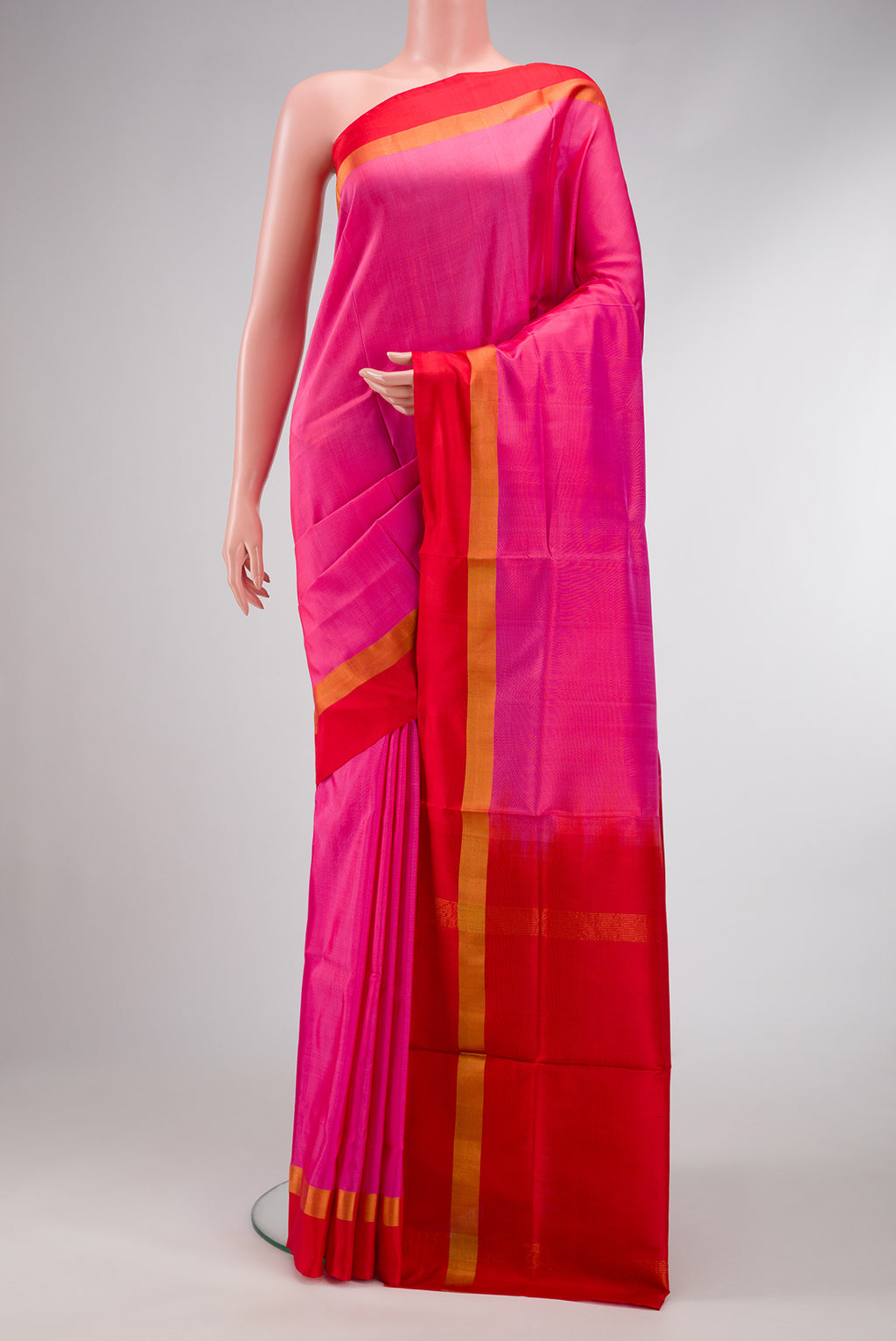Pink Dual Tone Uppada Silk Saree with Plain Body and Zari Border.  displayed on a mannequin