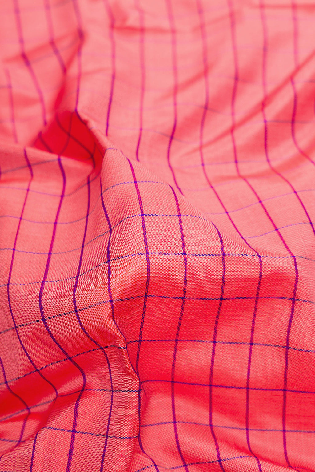 Close up of Pink Dual Tone Soft Silk Saree with Checked design on the body and Zari Border.  displaying folds