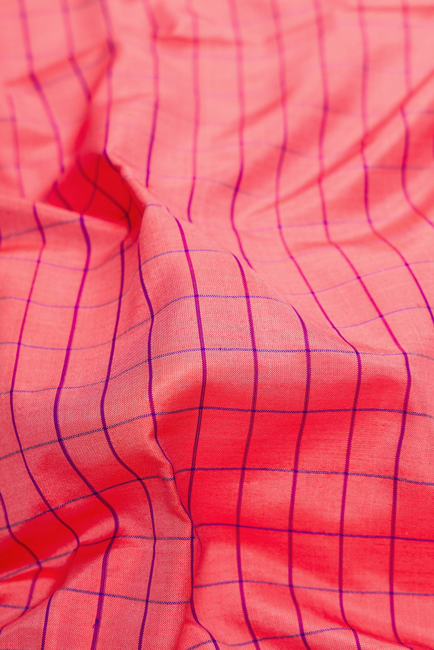 Close up of Pink Dual Tone Soft Silk Saree with Checked design on the body and Zari Border.  displaying folds