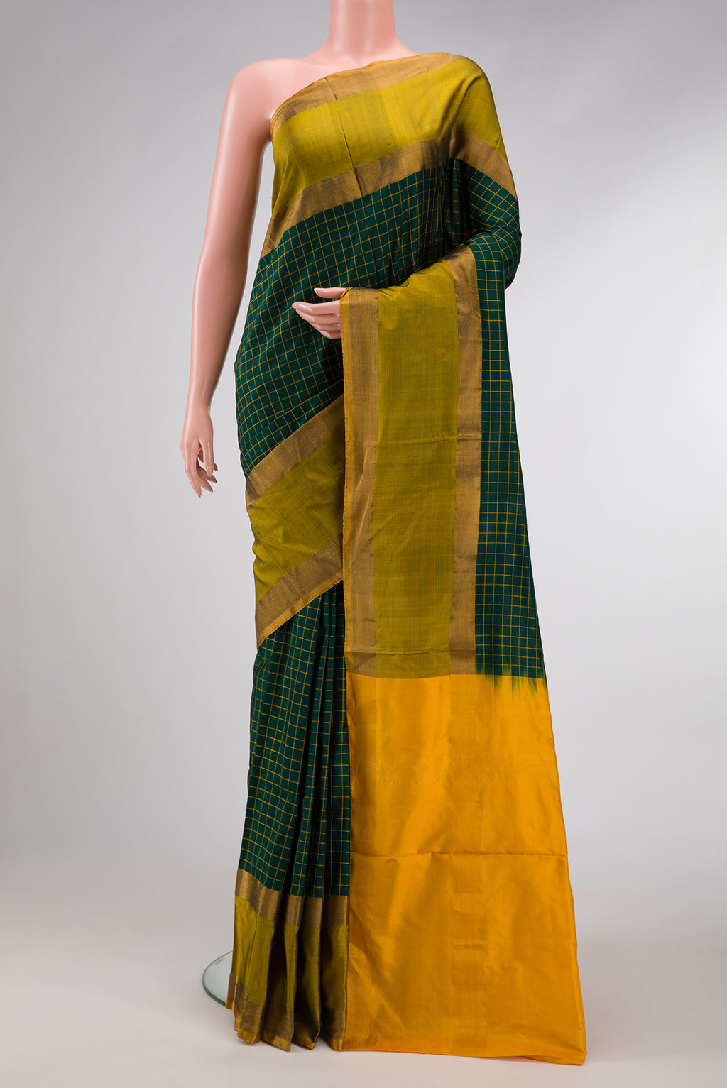 Green Dual Tone Soft Silk Saree with Zari Butta on the body and Zari Border.  displayed on a mannequin