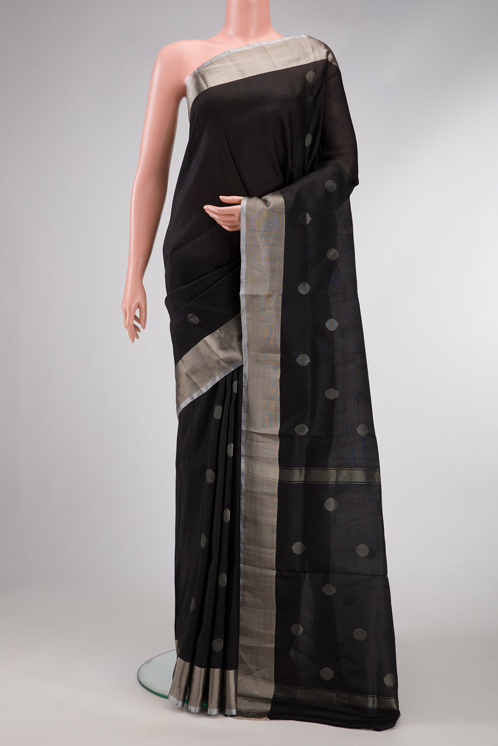 Black Dual Tone Uppada Silk Saree with Zari Butta on the body and Zari Border.  displayed on a mannequin