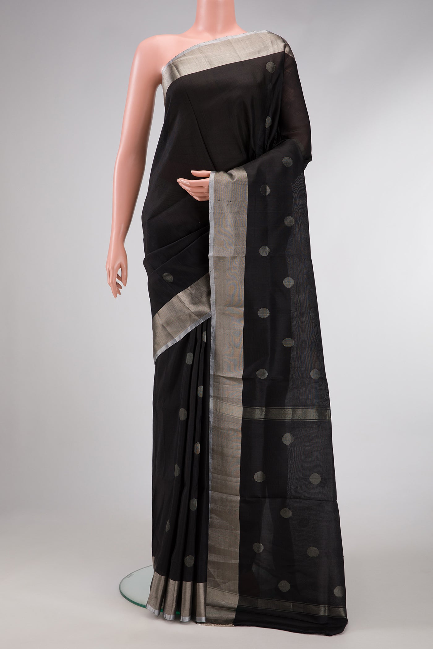 Black Dual Tone Uppada Silk Saree with Zari Butta on the body and Zari Border.  displayed on a mannequin