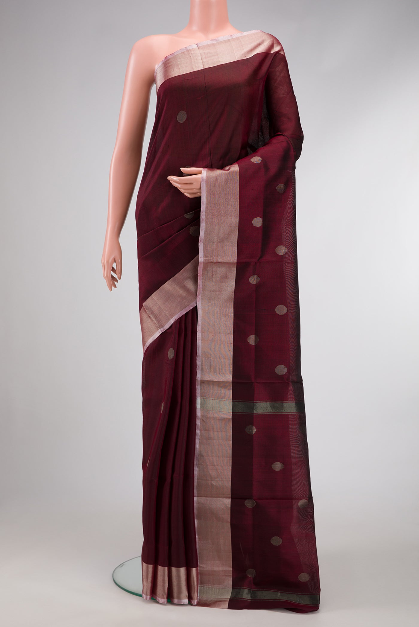 Maroon Dual Tone Uppada Silk Saree with Zari Butta on the body and Zari Border.  displayed on a mannequin