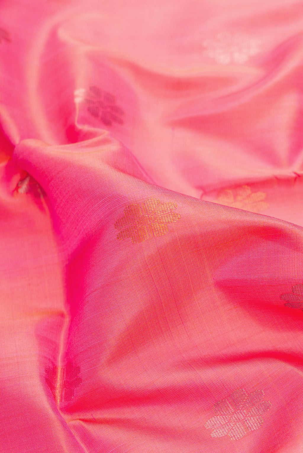 Close up of Pink Dual Tone Uppada Silk Saree with Zari Butta on the body and Zari Border.  displaying folds