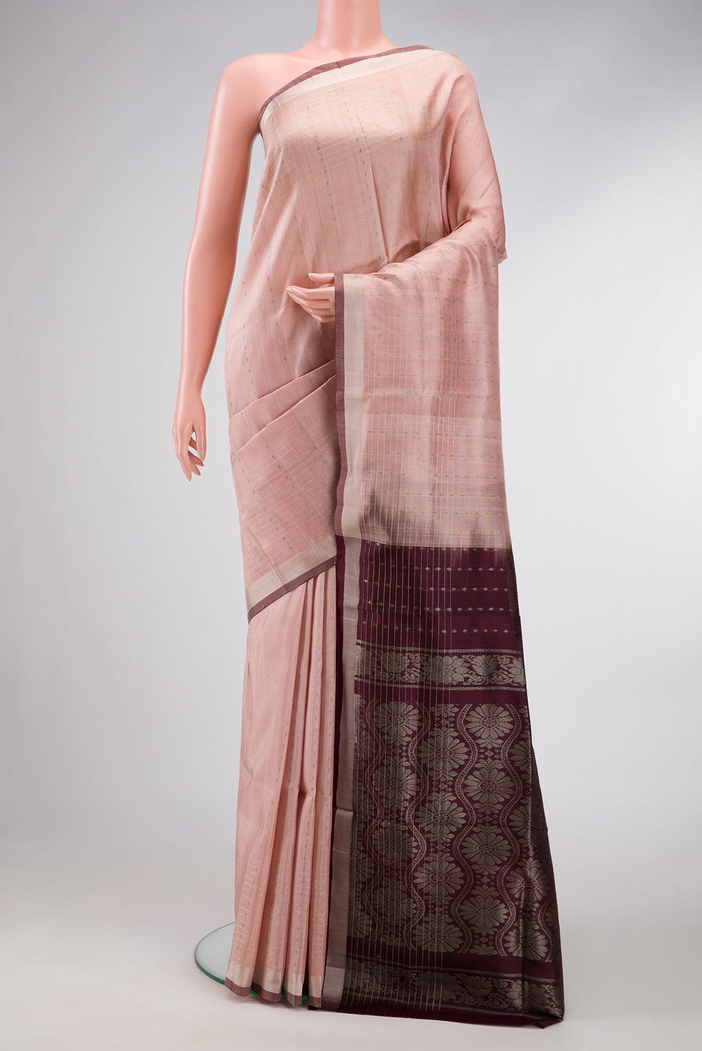 Rose Gold Dual Tone Uppada Silk Saree with Zari Butta on the body and Zari Border.  displayed on a mannequin