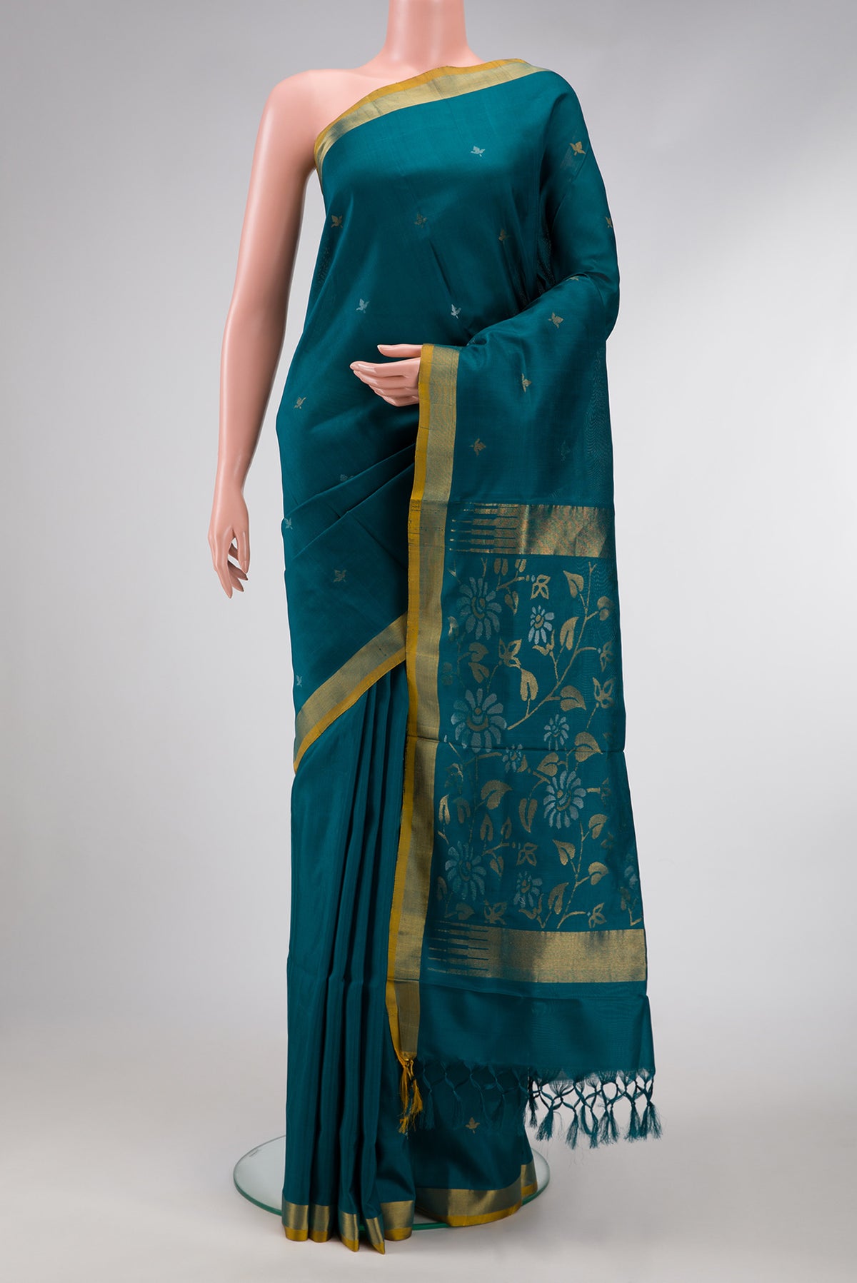 Maya Blue Dual Tone Uppada Silk Saree with Zari Butta on the body and Zari Border.  displayed on a mannequin