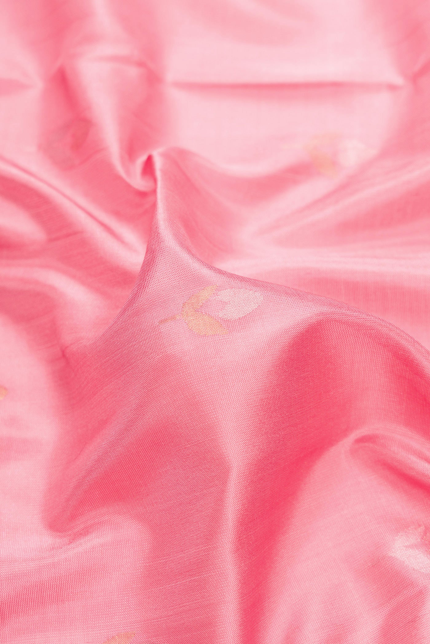 Close up of Pink Dual Tone Uppada Silk Saree with Zari And Thread Butta on the body and Zari Border.  displaying folds